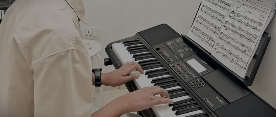 Student playing piano